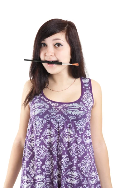 Girl with brush in mouth — Stock Photo, Image