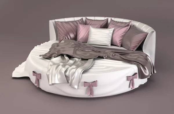 Cama redonda con almohadas en el interior del dormitorio —  Fotos de Stock