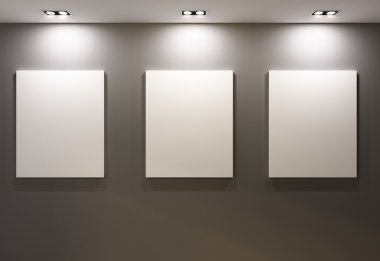 Empty frames on grey wall in gallary of museum interior
