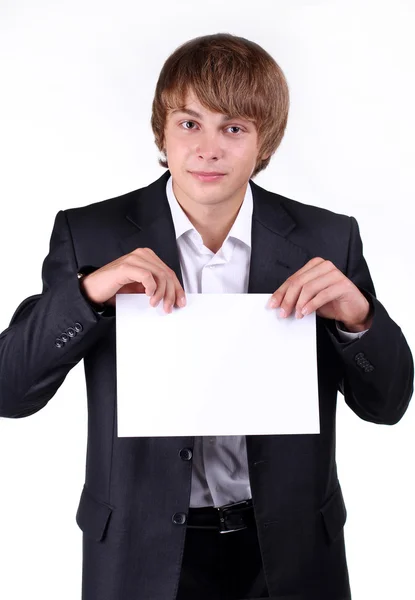 Ritratto di un giovane uomo d'affari sorridente che tiene un cartellone in bianco, mano — Foto Stock