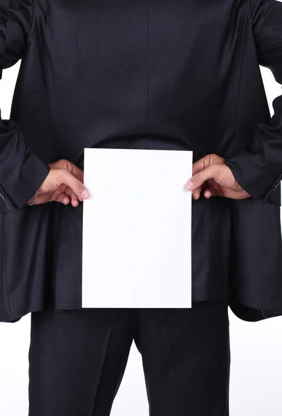 Businessman holding a blank white board on his back — Stock Photo, Image
