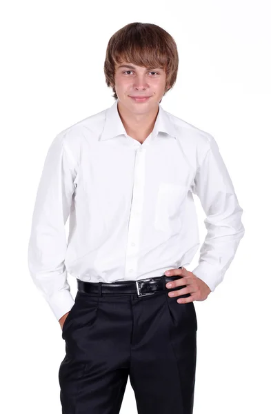 Porträtt av en snygg ung man som står med händerna i fickorna — Stockfoto