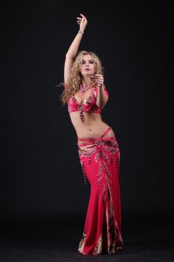 Beautiful curly blonde in the active Arab Dance clipart