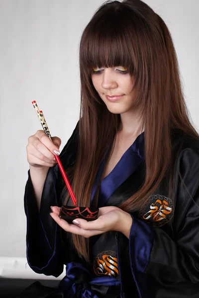 Japanese Geisha with red chopsticks — Stock Photo, Image