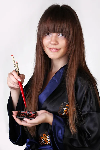 Geisha giapponese con bacchette rosse — Foto Stock
