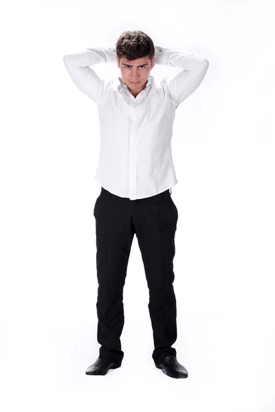 Stylish young man standing with hands on head — Stock Photo, Image
