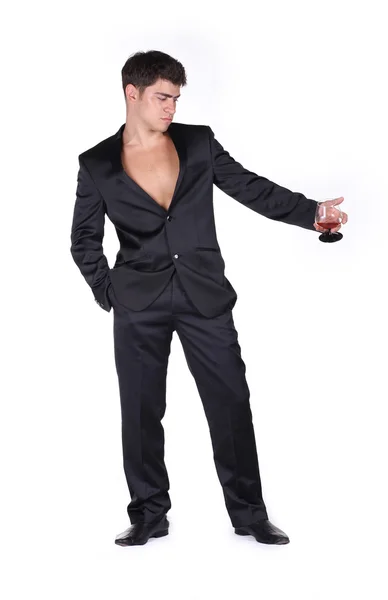 Siyah elbiseli bardak konyak w izole holding iş adamı — Stok fotoğraf