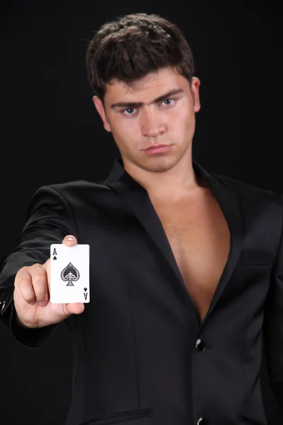 Cool young man holding four aces, shuffle the cards — Stock Photo, Image