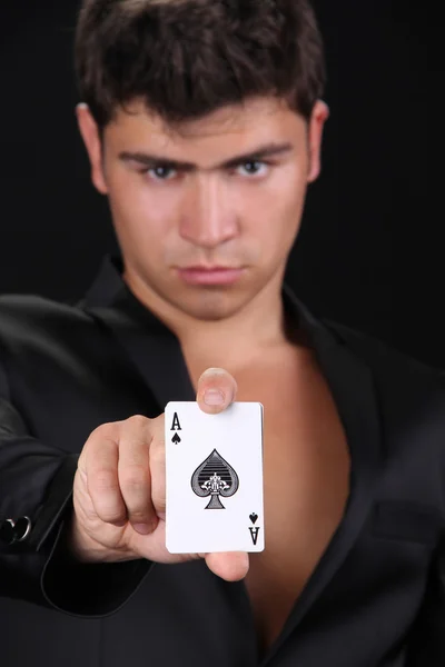 stock image Cool young man holding four aces, shuffle the cards