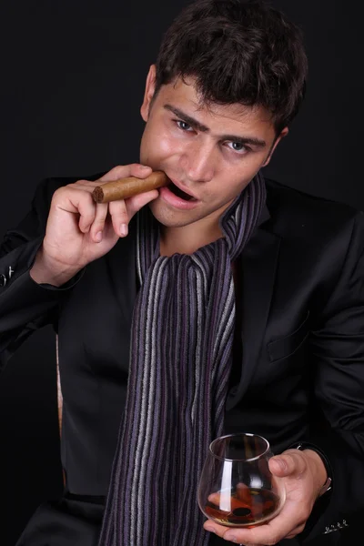 stock image Handsome man holding cigar with smoke