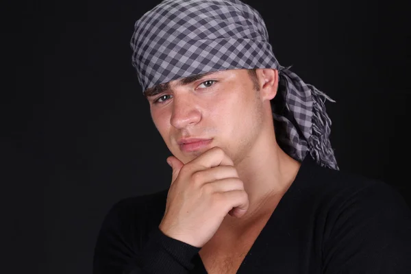 Portrait of man in b bandana on dark background — Stock Photo, Image