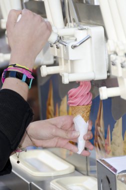 Woman's hand making a Italian ice cream clipart