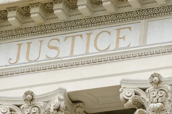 Justice word engraved — Stock Photo, Image