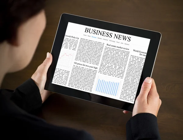 Reading Business News on Tablet PC — Stock Photo, Image