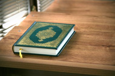 Quran - holy book of Muslims clipart