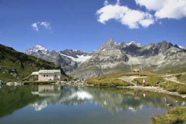 Touristic refuge in alps clipart