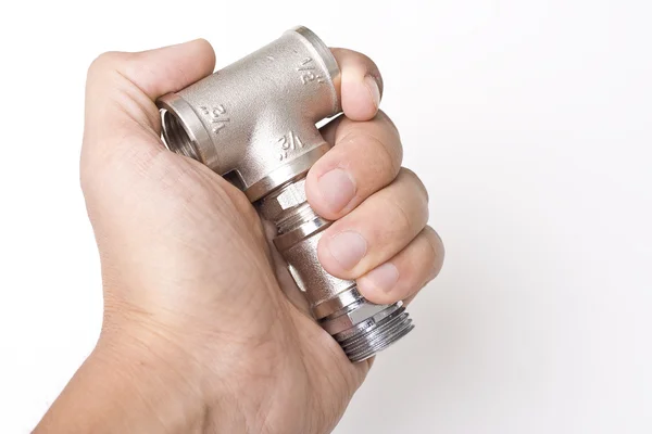 stock image Connectors of plumbing pipes in the hand