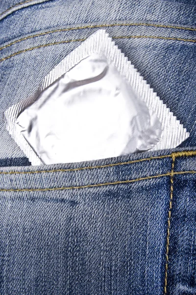 Stock image Condom in jeans' pocket