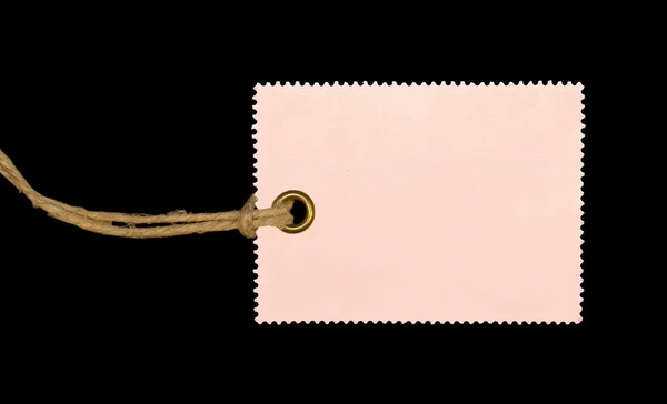Różowy pustego tagu na białym tle na czarnym tle — Zdjęcie stockowe