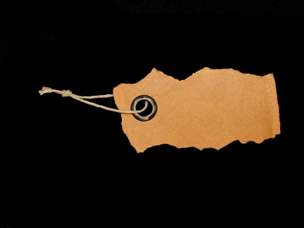 Cardboard blank tag isolated on black background — Stock Photo, Image