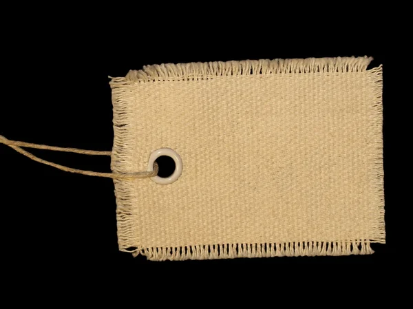 Порожня текстильна мітка ізольована на чорному тлі — стокове фото