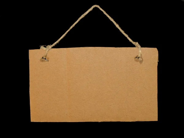Blank cardboard tag tied isolated on black background — Stock Photo, Image
