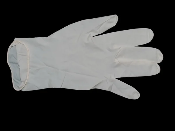 Latexové chirurgické rukavice izolovaných na černém pozadí — Stock fotografie