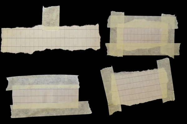 Set paper scraps and masking tape isolated on black background — Stock Photo, Image