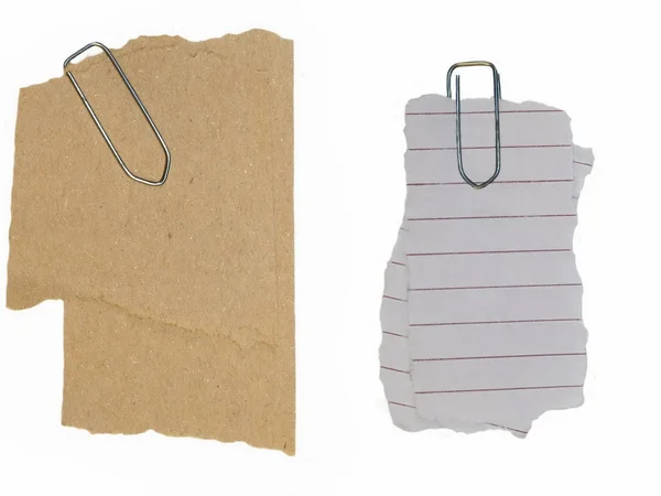 Desechos de papel y clip aislados sobre fondo blanco — Foto de Stock