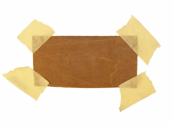 Cardboard scrap and masking tape isolated on white background — Stock Photo, Image