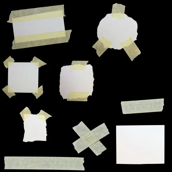 Set paper scraps and masking tape isolated on black background — Stock Photo, Image