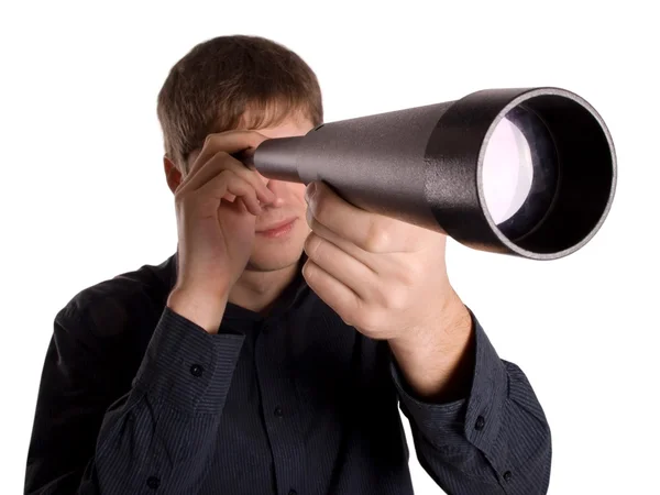Man looking through a telescope — Stock Photo, Image