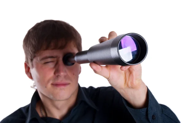 Man looking through a telescope — Stock Photo, Image