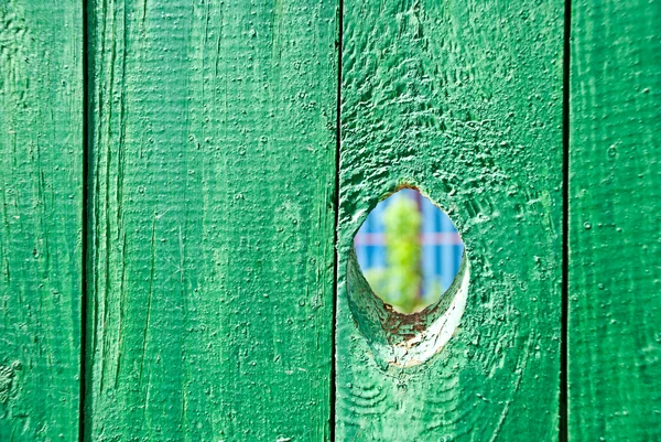 Hole in a fence — Stock Photo, Image