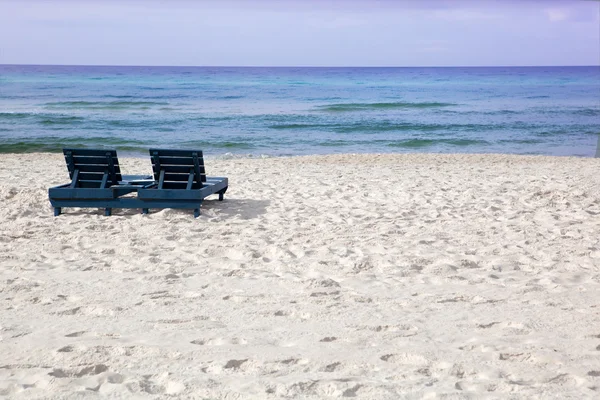 stock image Empty beach chairs by ocean