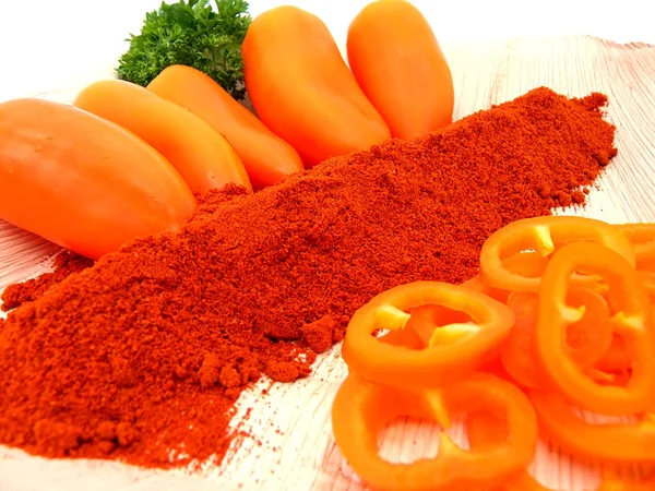 stock image Chili powder, orange peppers with smoked paprika and slices,