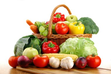 Composition with raw vegetables and wicker basket clipart