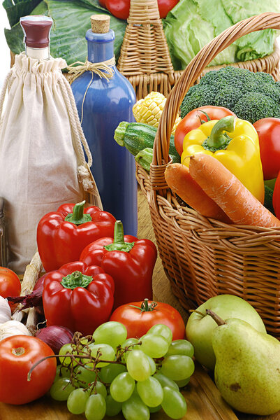 Composition with raw vegetables and wicker basket