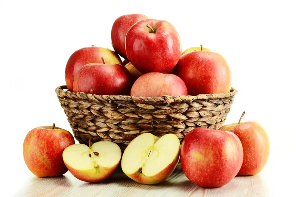 Apples and wicker basket isolated on white — Stock Photo, Image