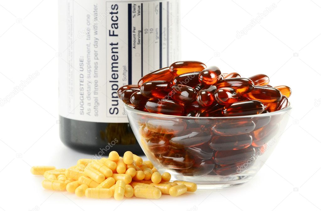 Composition with dietary supplement capsules and kitchen dish