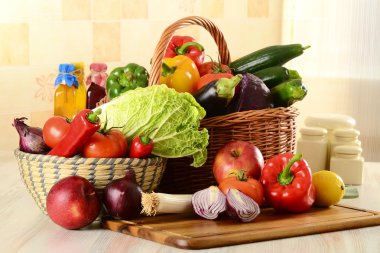 Raw vegetables on kitchen table clipart