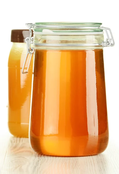 Large jar of honey isolated on white — Stock Photo, Image