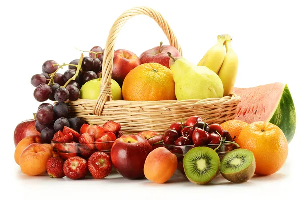 Fruits and wicker basket — Stock Photo, Image
