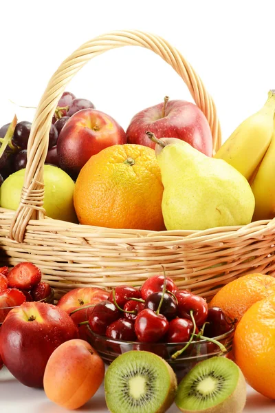 Fruits and wicker basket — Stock Photo, Image