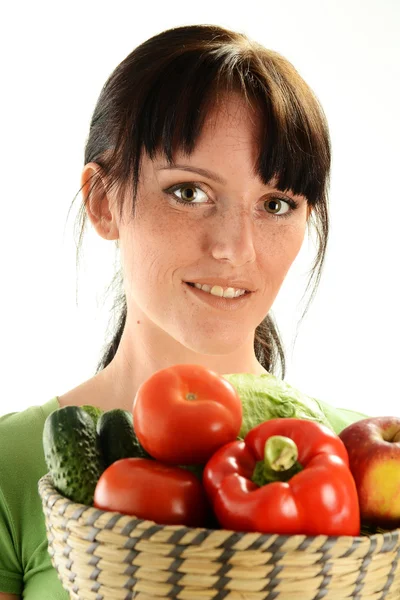Young woman holding dish with vegetables on white background — Stock Photo, Image