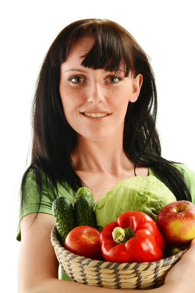 Young woman holding dish with vegetables on white background — Stock Photo, Image