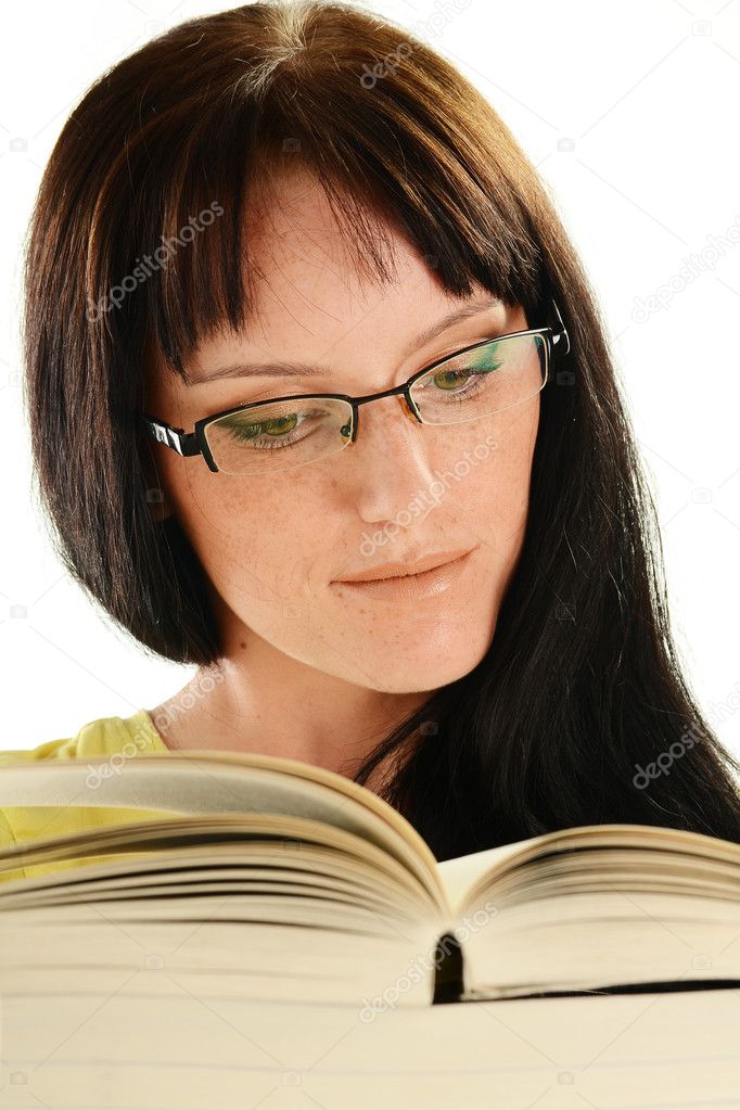 Young woman reading a book isolated on white