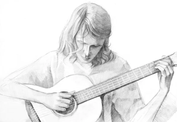 年轻吉他手中的铅笔 免版税图库照片