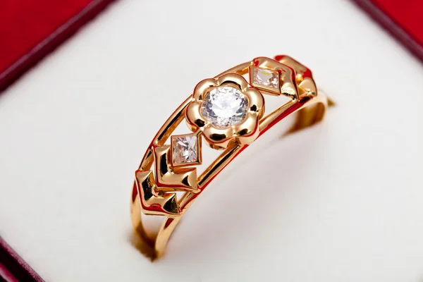 Gold ring with white zirconia enchased — Stock Photo, Image