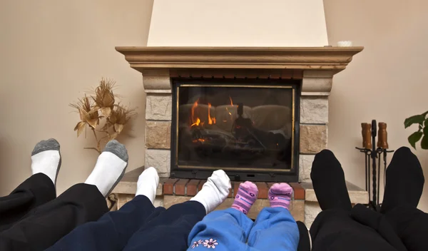 stock image Family at a fireplace